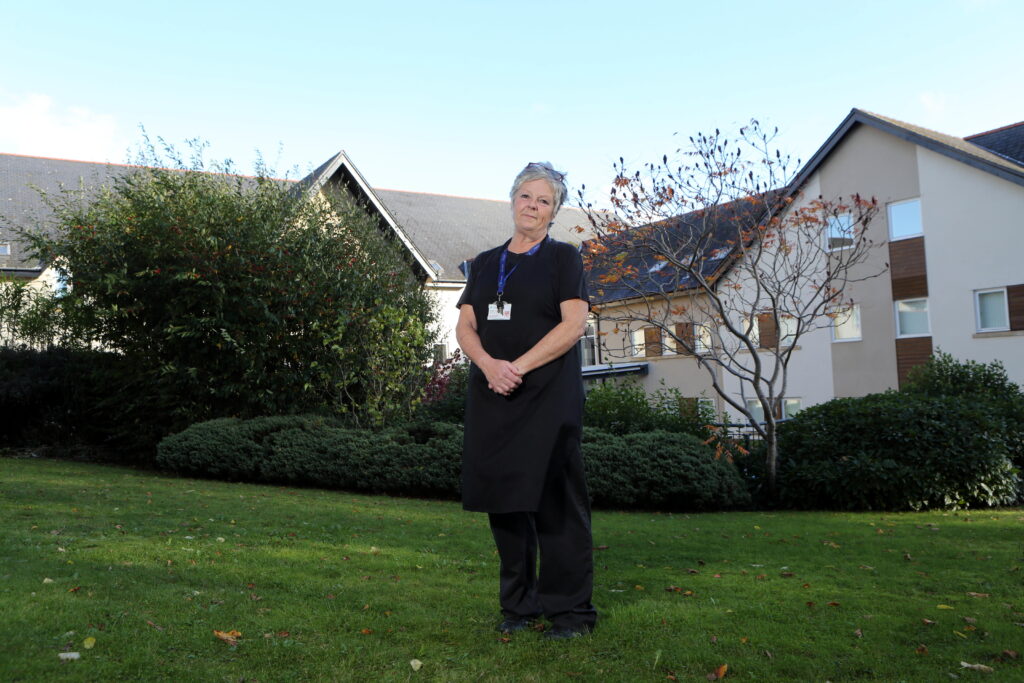 Woman standing in front of building