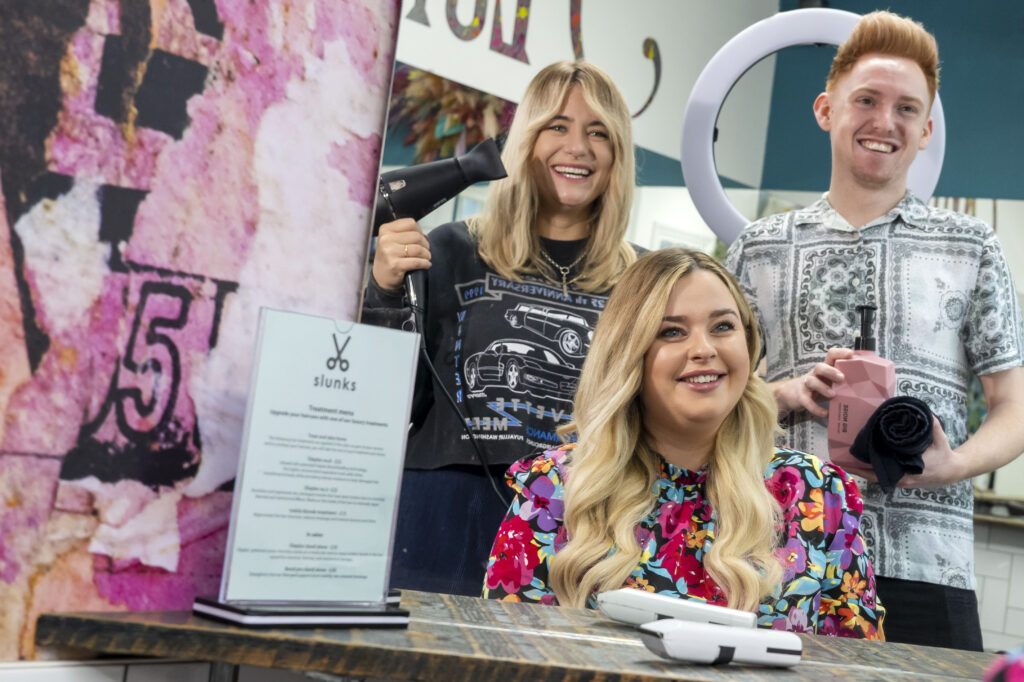 Press shot of 3 hair stylists in Slunks hair salon 
